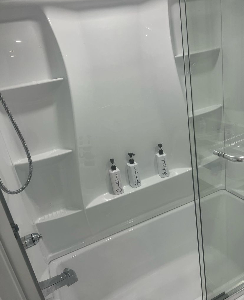 Clean, modern shower with built-in soap dispensers